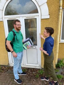 Dan Boardman and Carla Denyer knocking on a door.