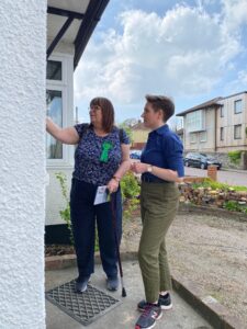 Carla Denyer and Jenny Vernon knocking on a door.